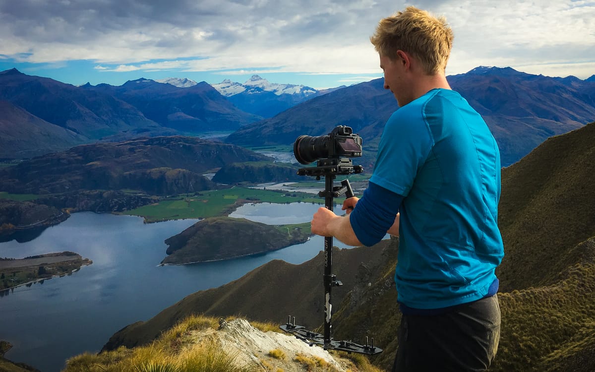 Documentary filmmaker walking in sync with subject to maintain focus
