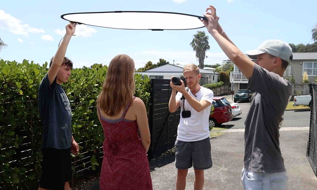 Diffusion panel softening harsh sunlight for documentary filming