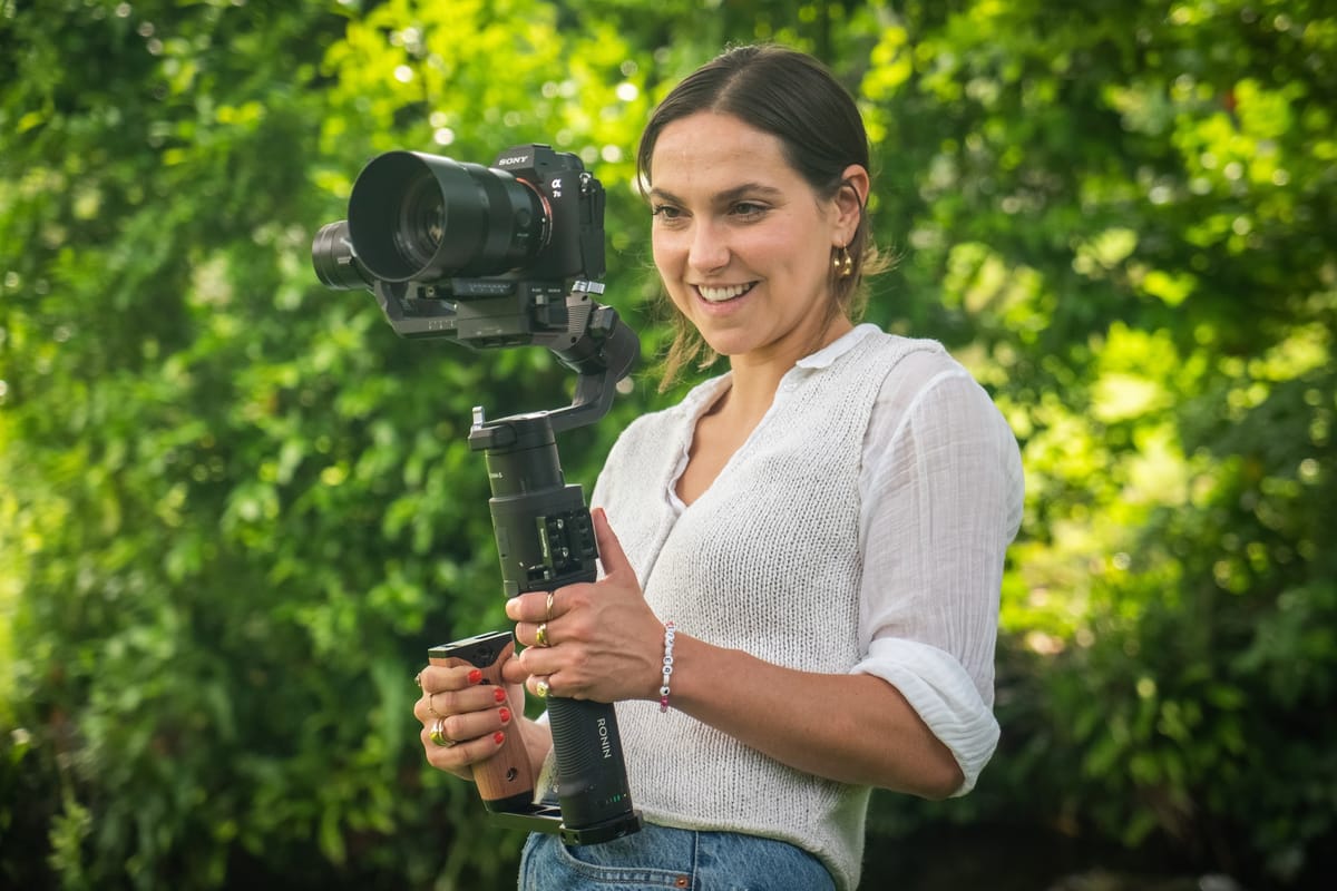 Filmmaker using a gimbal for smooth documentary camera movement