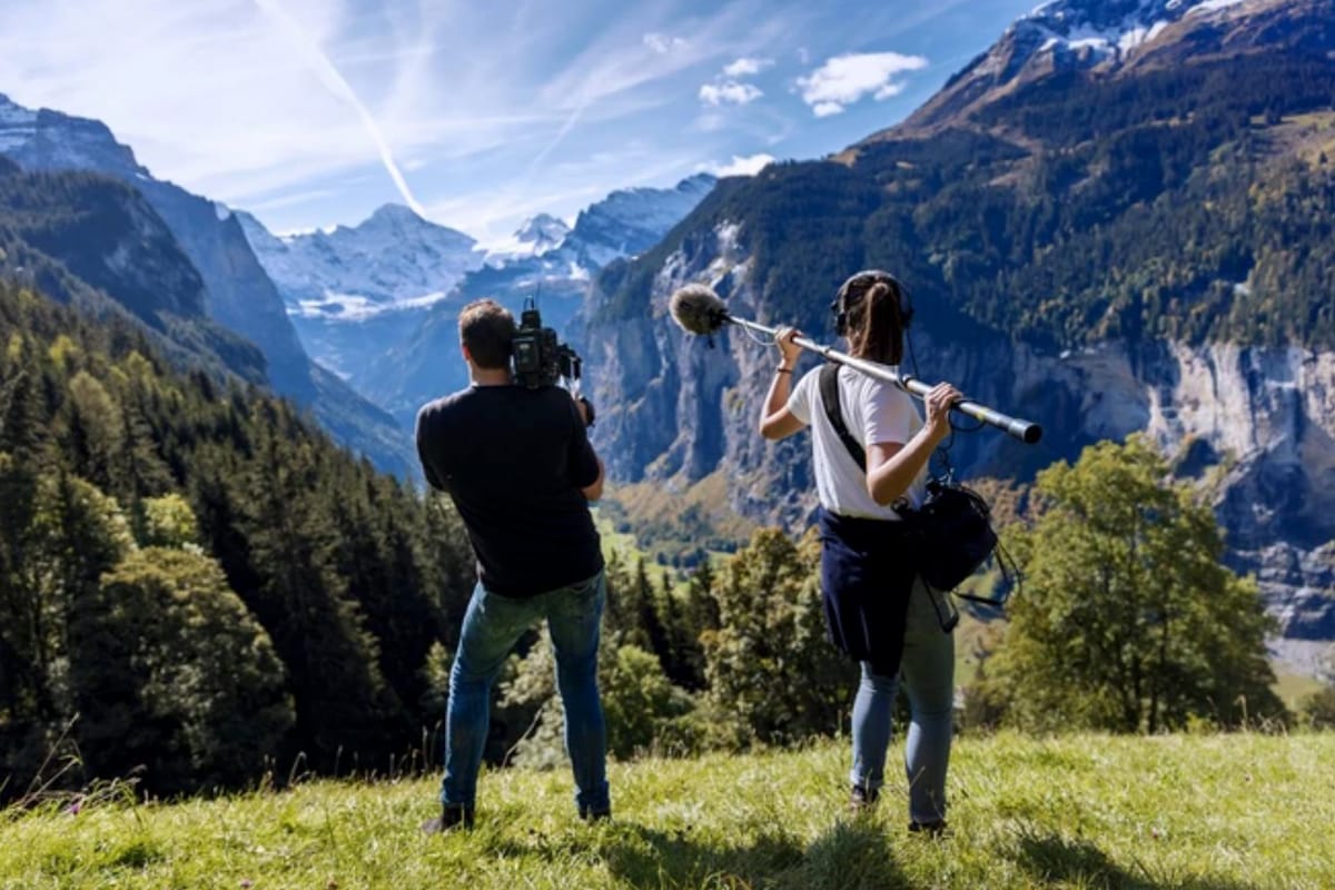 Sound recordist capturing audio on a documentary film set
