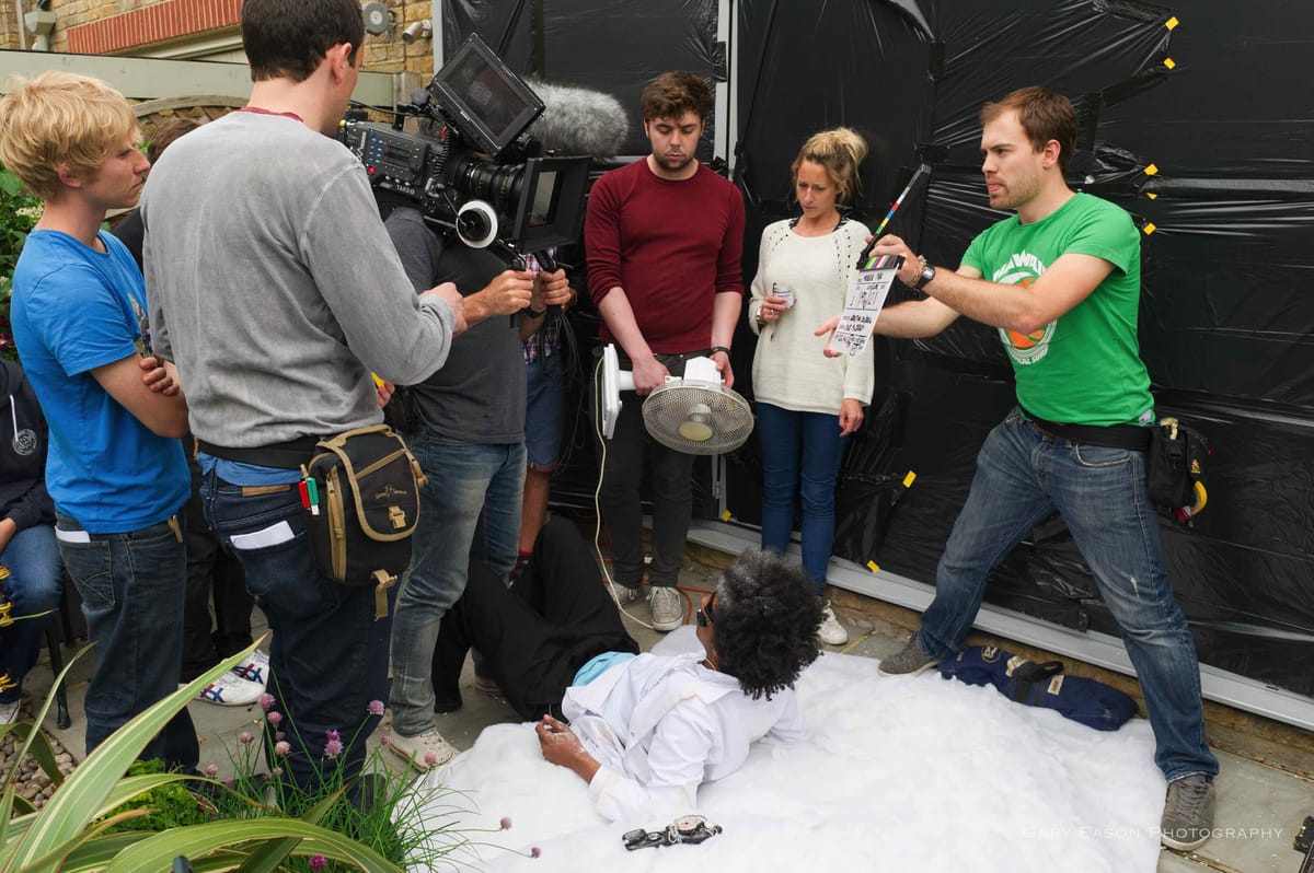 Documentary film crew working together on set