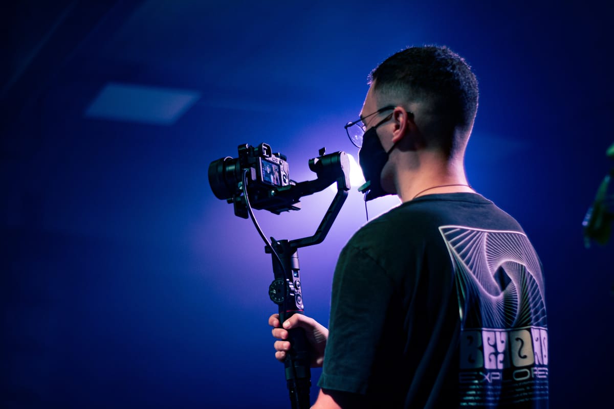 Filmmaker using a gimbal to create cinematic footage