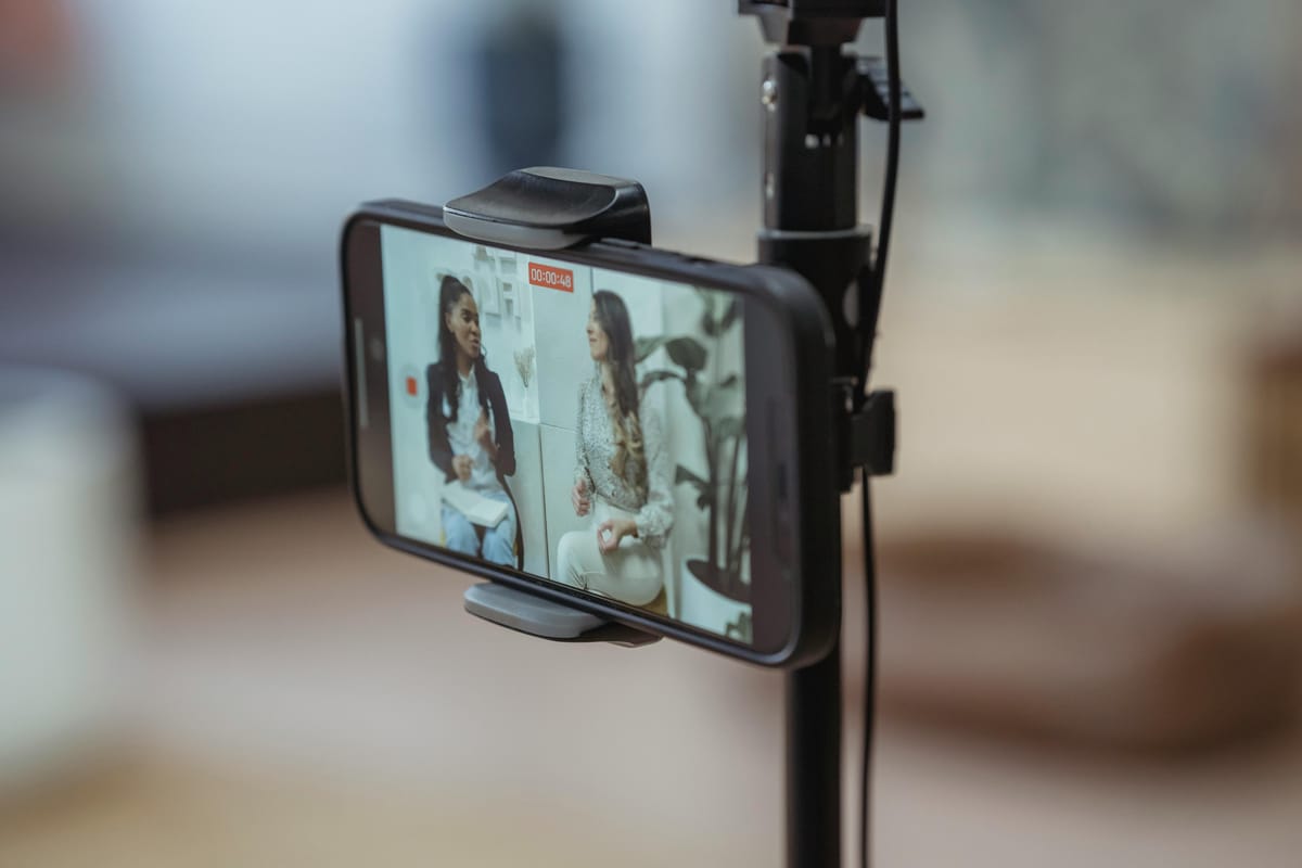 Smartphone mounted on tripod for documentary filming