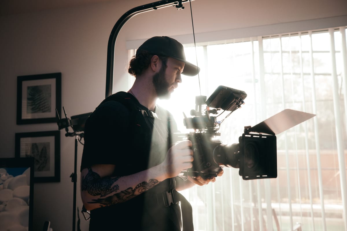 Filmmaker setting up cinematic lighting on a documentary shoot