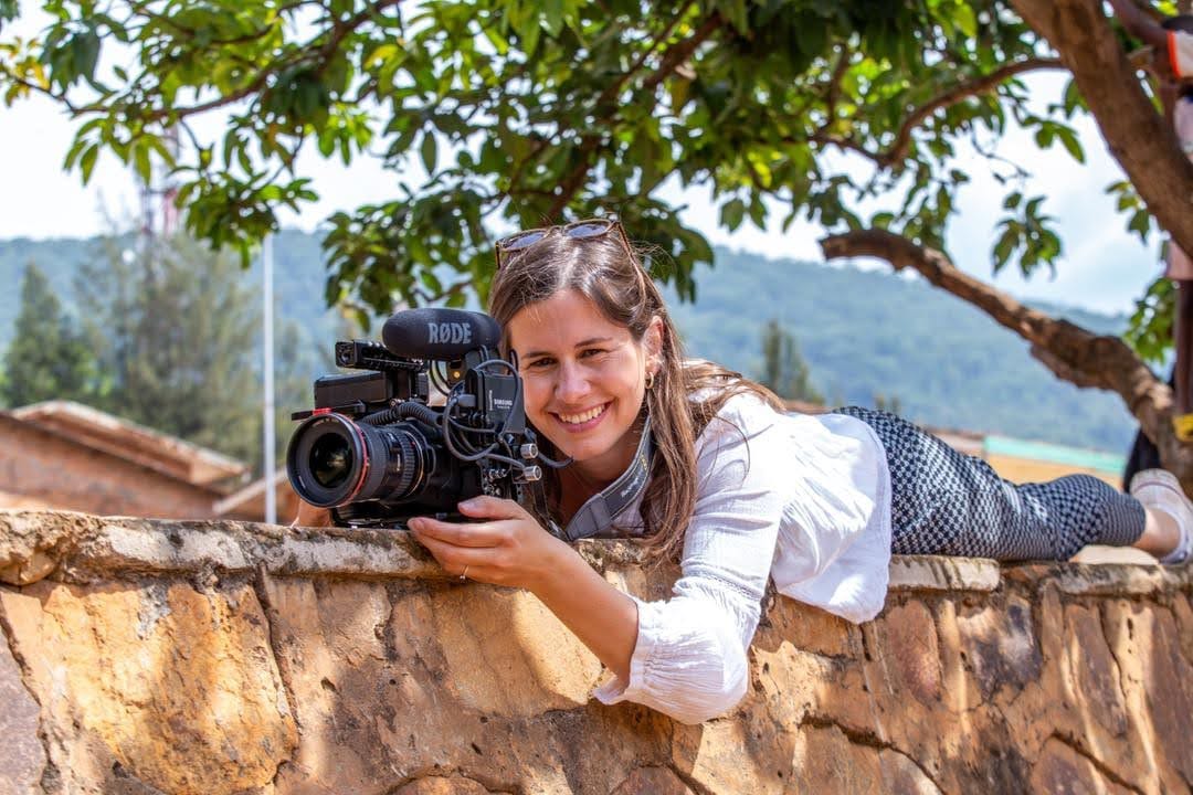 Solo documentary filmmaking equipment setup with camera, tripod, and microphone