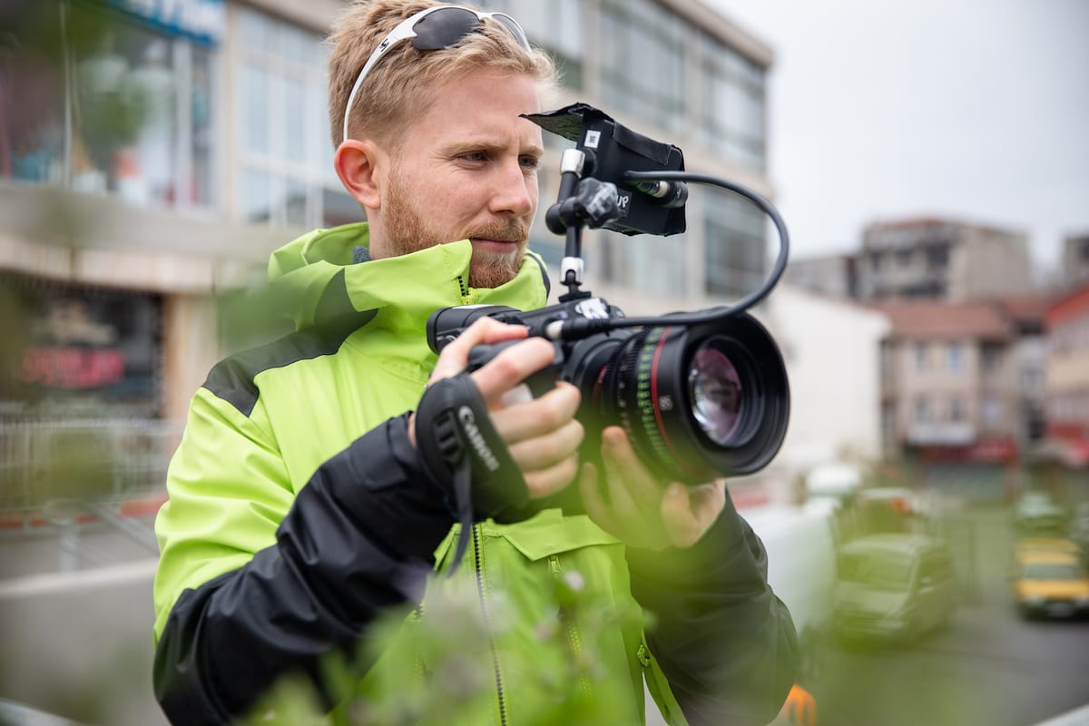 Documentary filmmaker setting up an interview for a narration-style scene