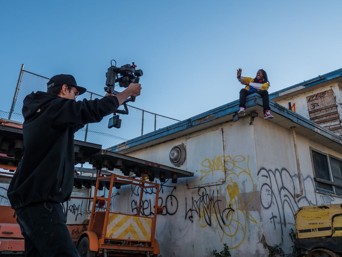 Filmmaker demonstrating steady gimbal walking technique