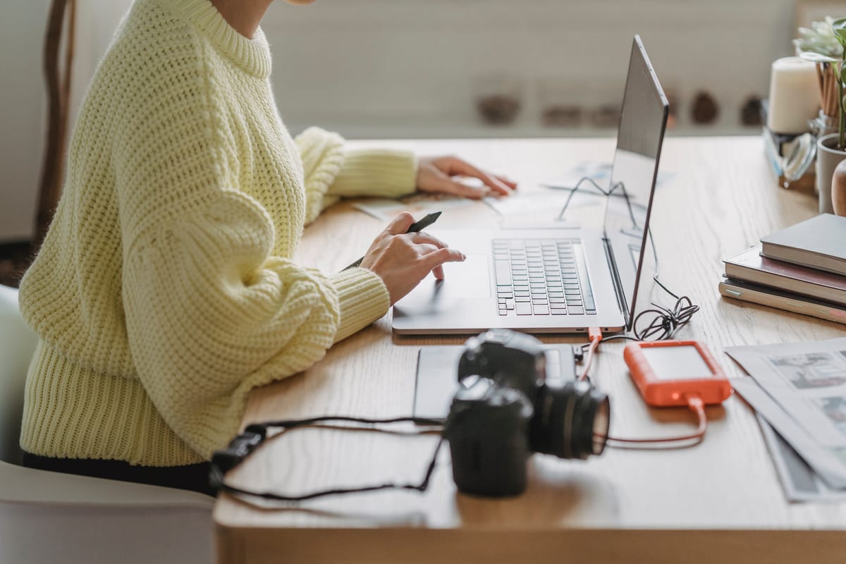Filmmaker organising documentary footage on a computer
