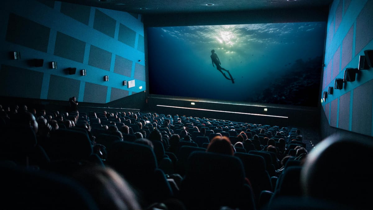 One Breath playing on a cinema screen to a full audience