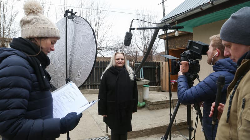 Setting up to film an interview outdoors