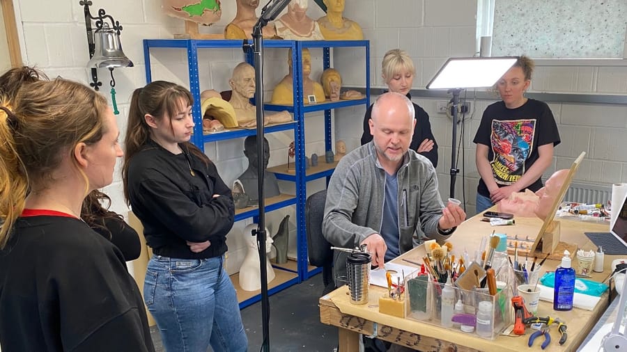 David Malinowski teaching silicone painting to a small group in his workshop