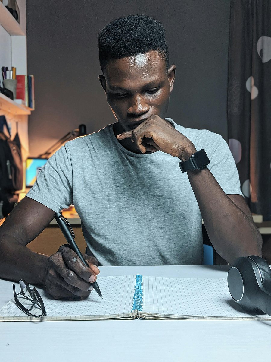 A man writing in a journal