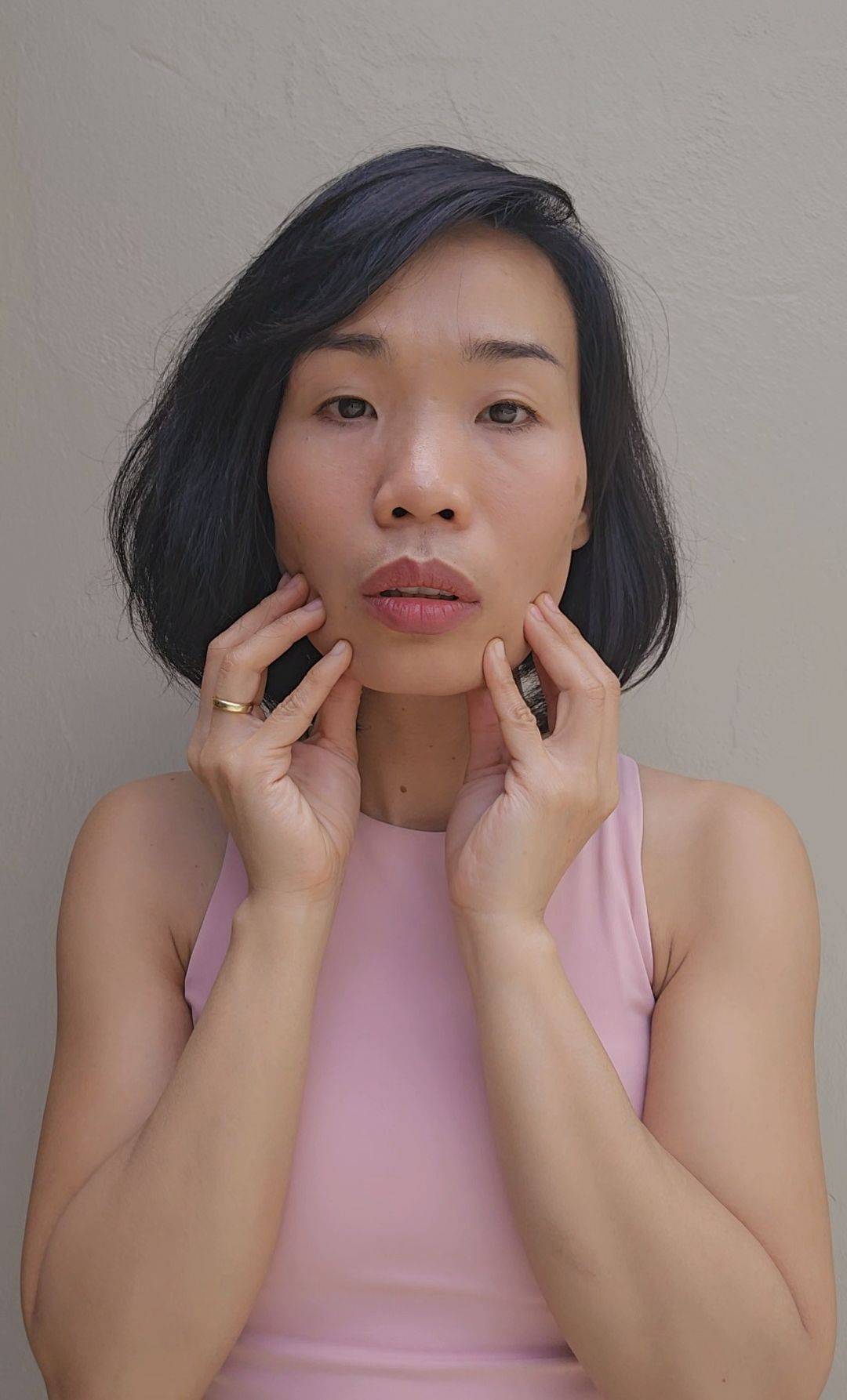 Woman doing facial exercise