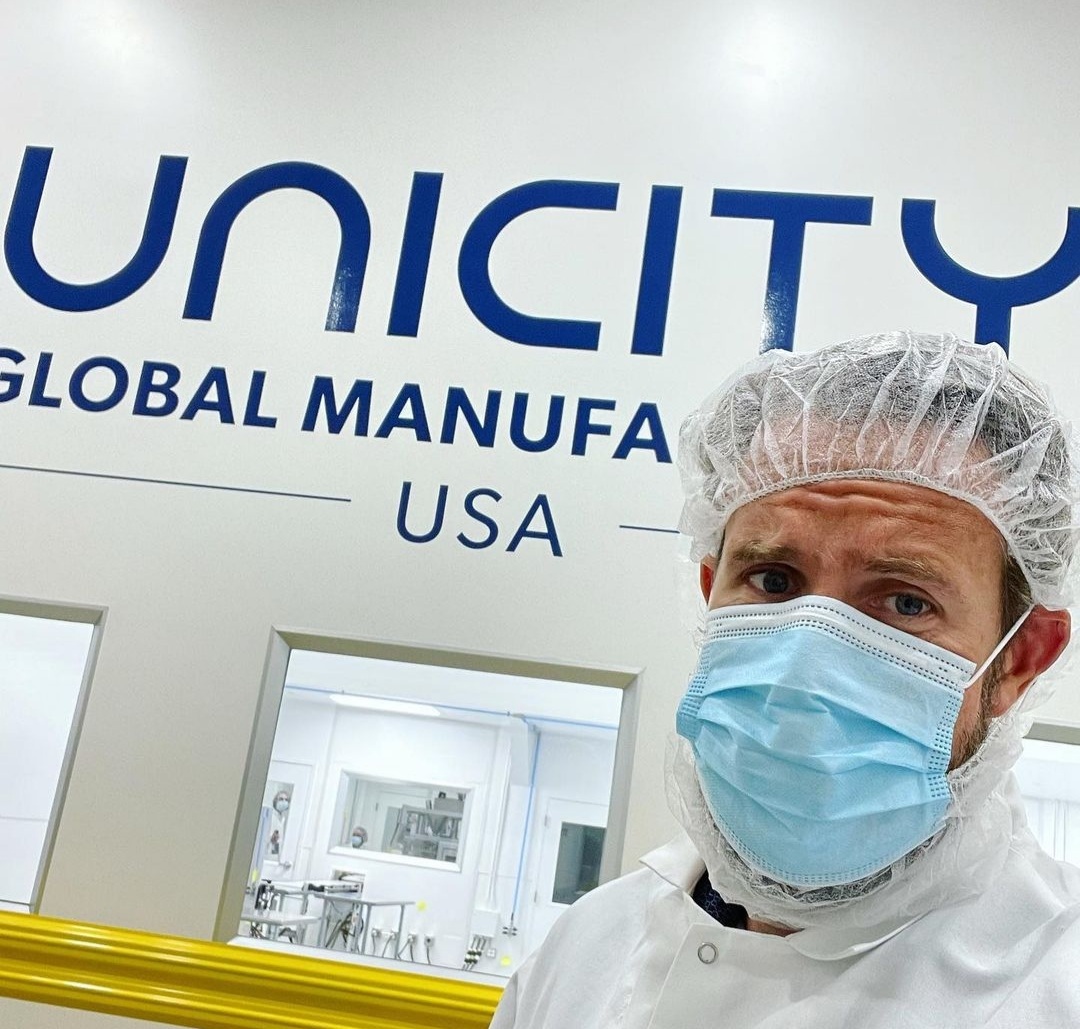 image of production worker inside the Unicity Global Manufacturing USA FDA approved production facility in Utah