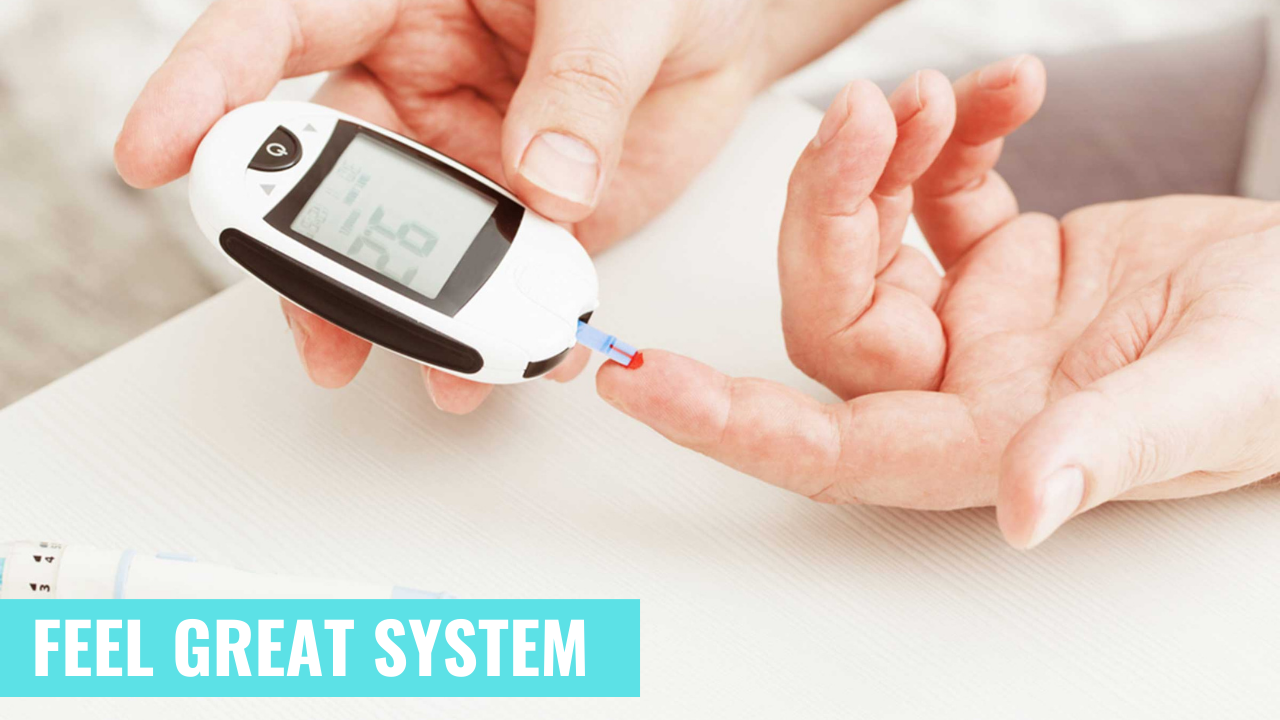 Close-up of hands using a glucometer to check blood sugar levels with the 'FEEL GREAT SYSTEM' logo visible, promoting diabetes management.