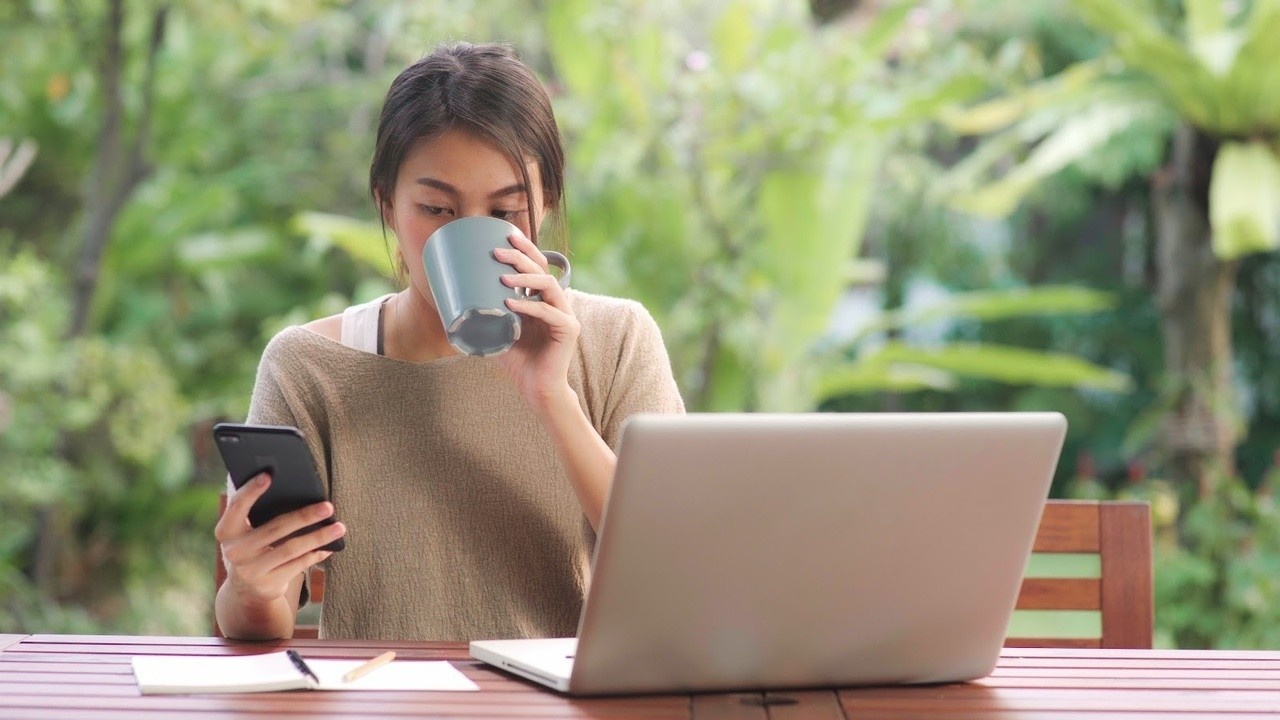 A woman working on her laptop.