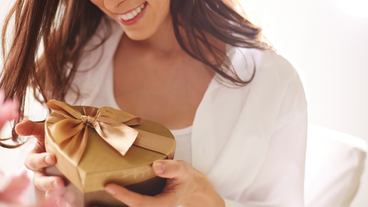 Women receiving a gift expressing gratitude