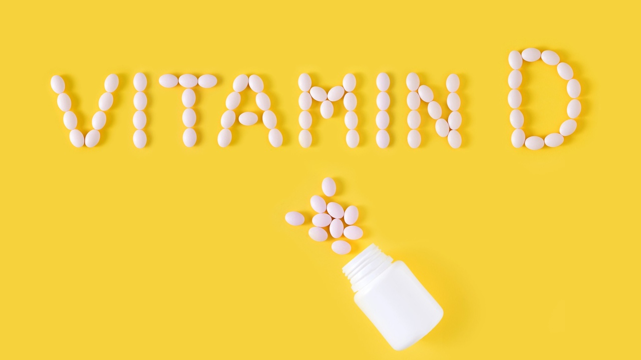 vitamin d spelled out with vitamin d tablets