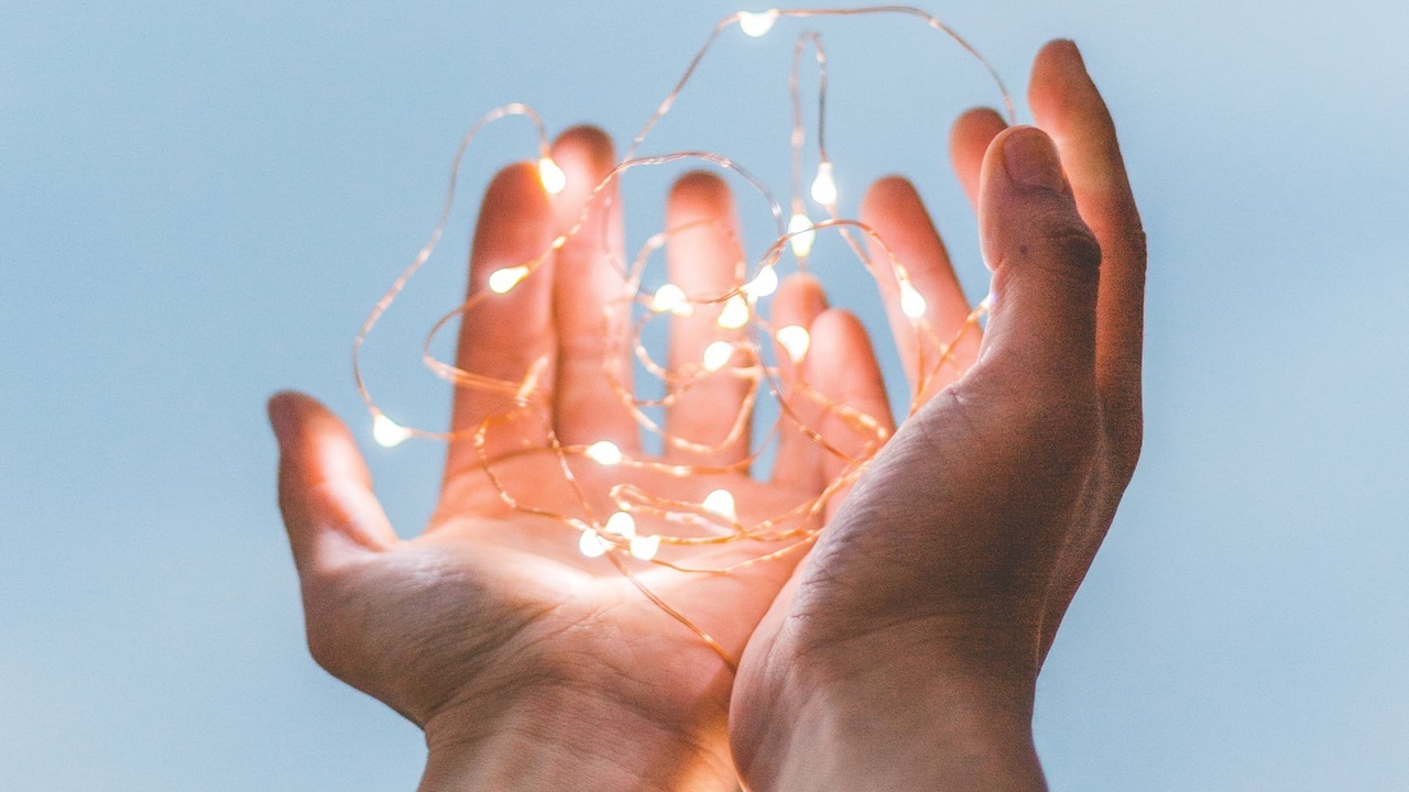 Hands with fairy lights