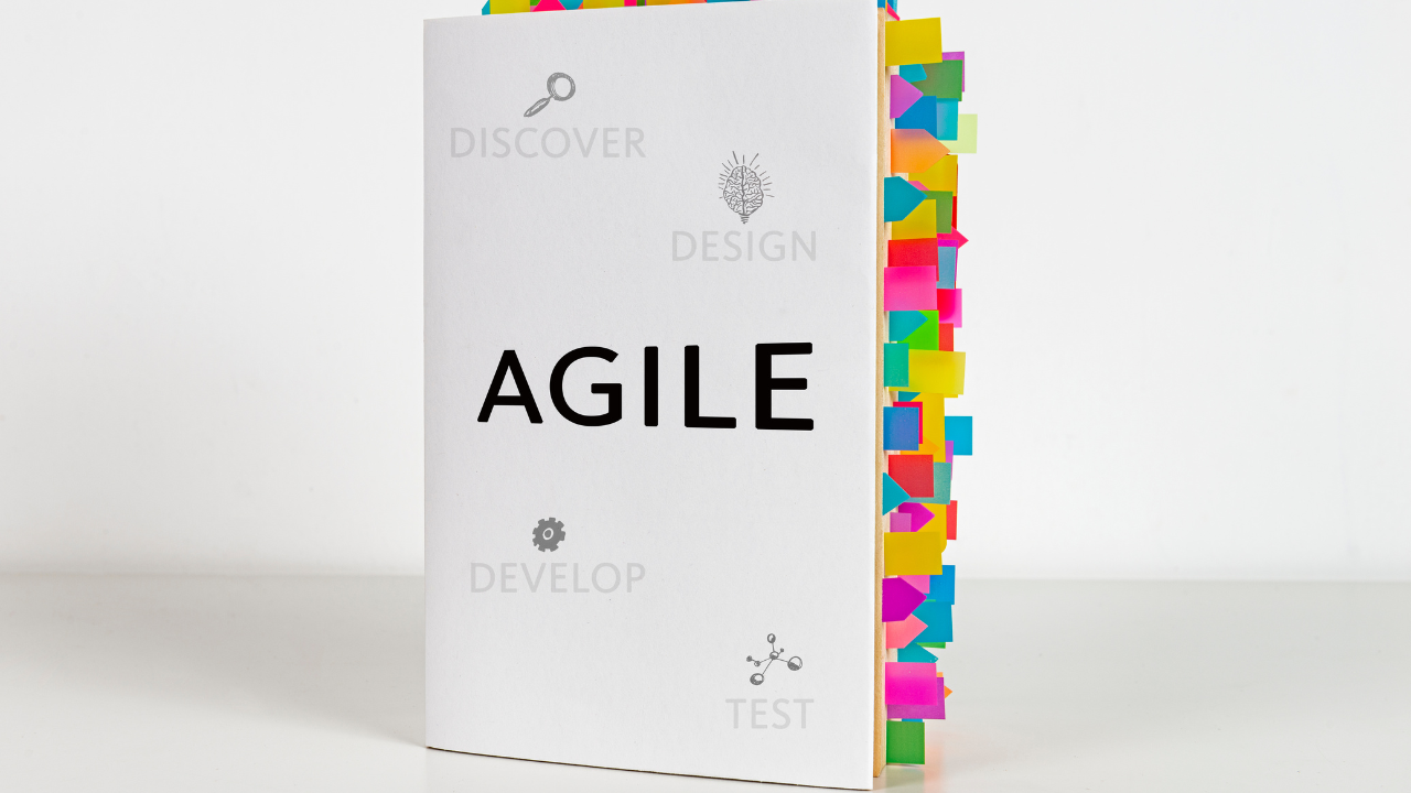 Book with Agile on the cover and tabs for notes