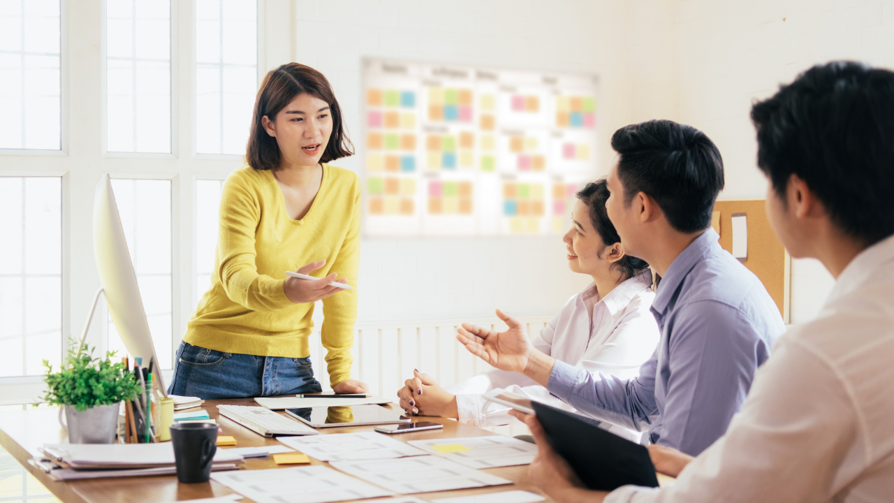 Team discussion at a table with papers