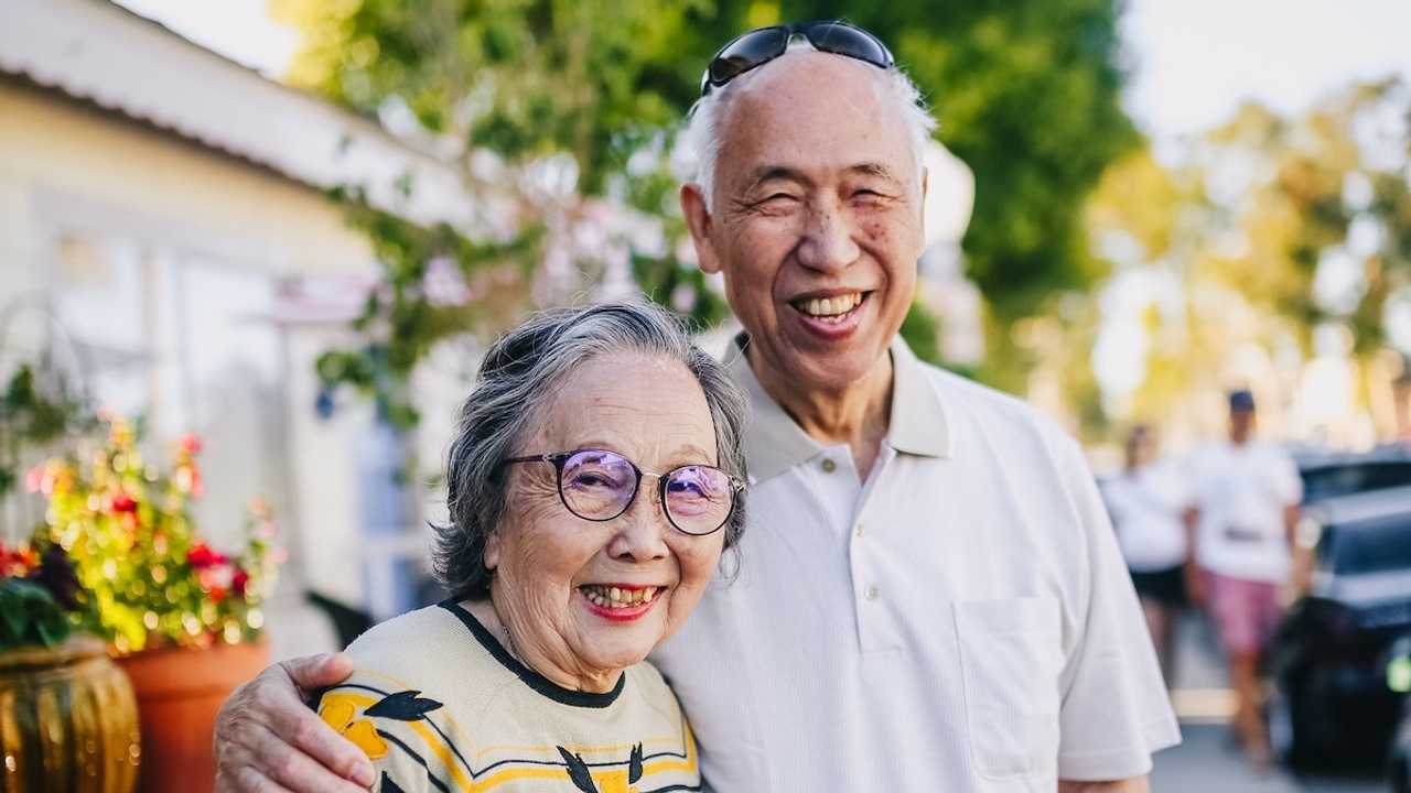 smiling elder woman and man