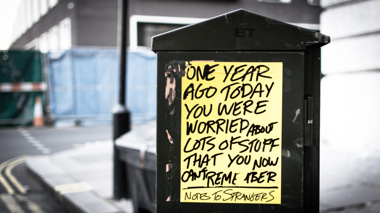 yellow hand lettered sign about not remembering what you were worrying about a year from now