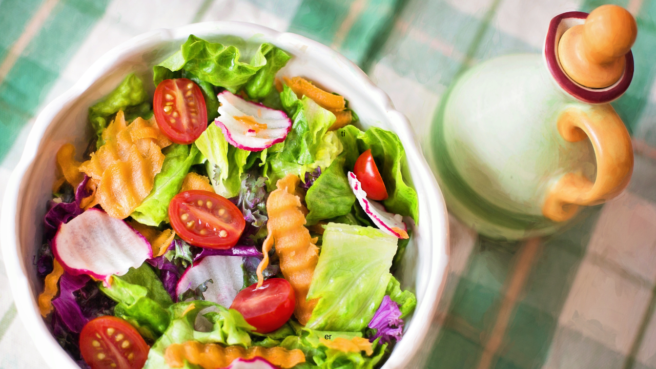 salad bowl with tomatoes, radishes, carrots, lettuce in a bowl 