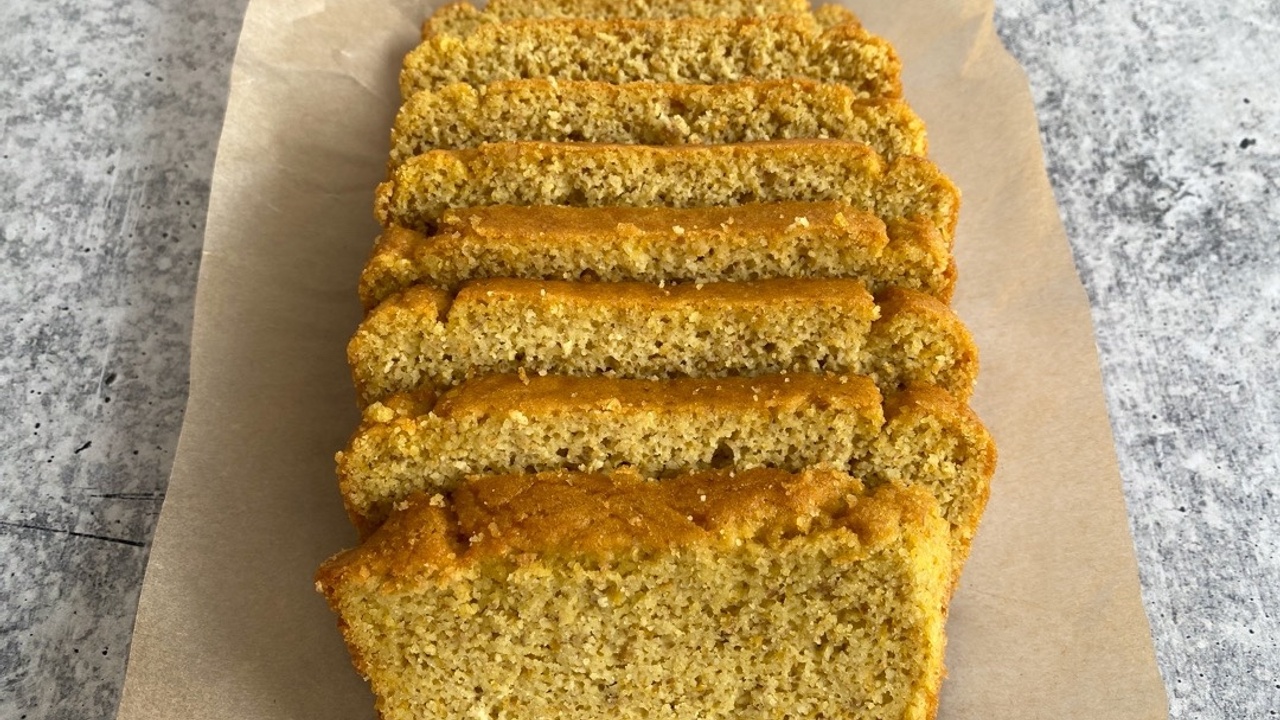 sliced paleo olive oil bread loaf on parchment paper