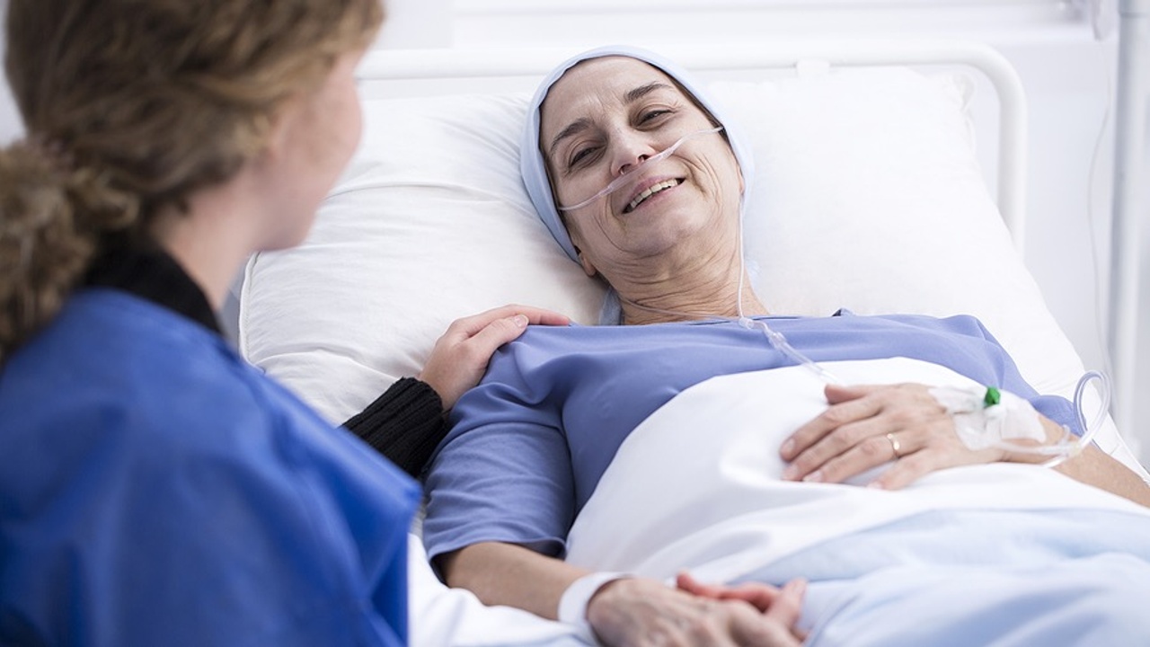 Young girl visiting sick woman in hospital