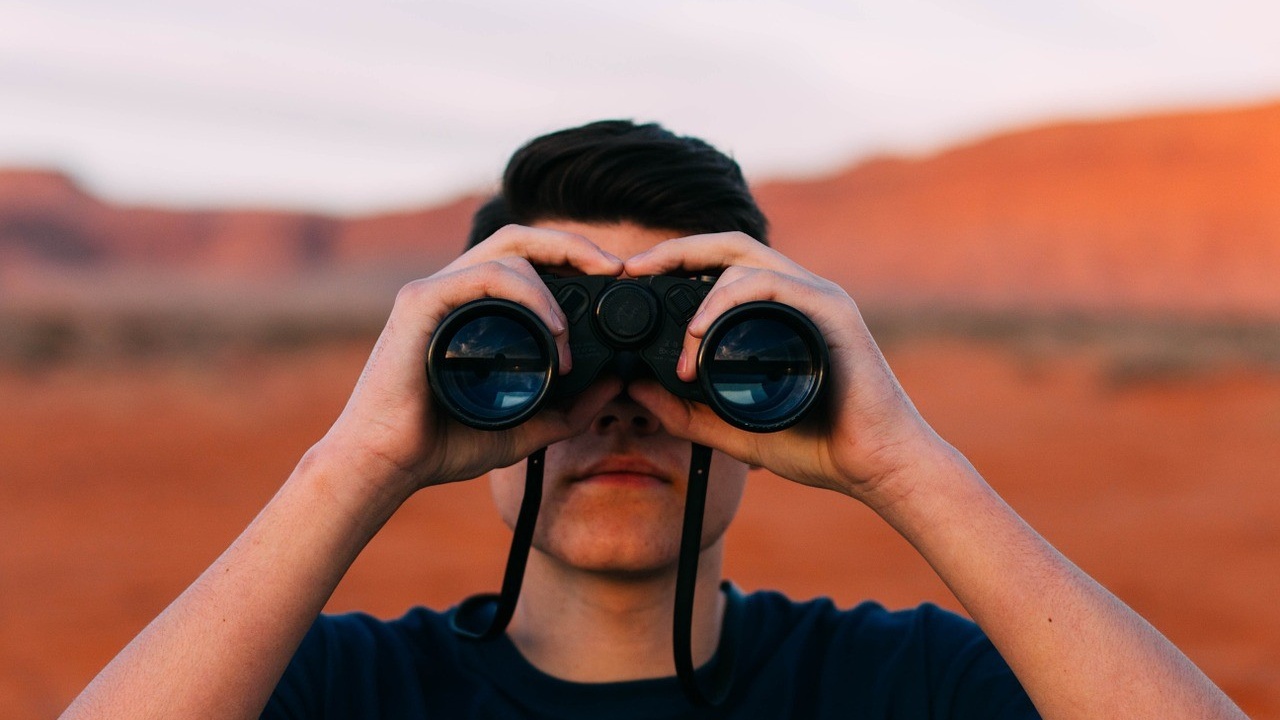 man with binoculars