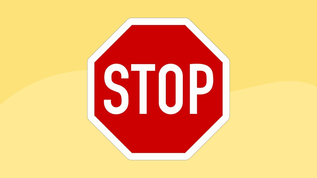 This image displays a classic stop sign with bold, white 