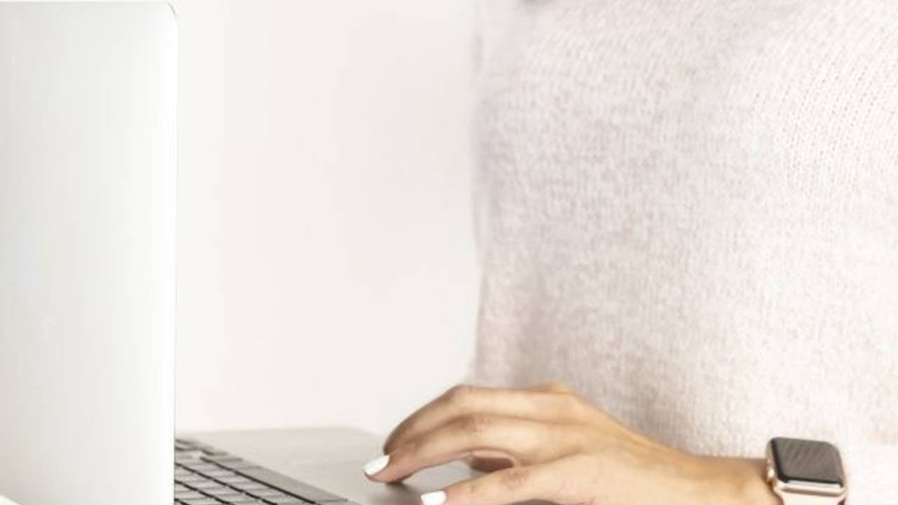 person typing on a laptop