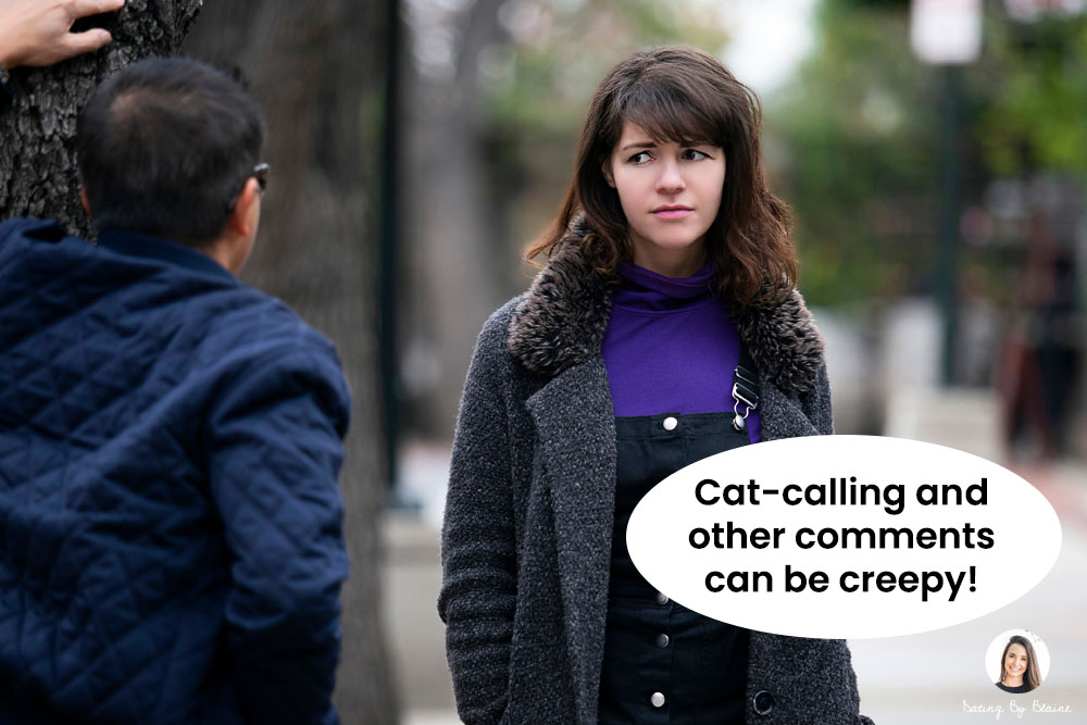 Man leaning on tree, talking to woman, who wears an uncomfortable expression on her face