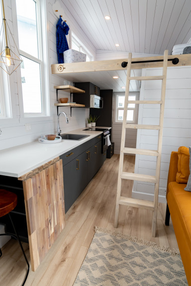 kitchen and loft in a tiny house