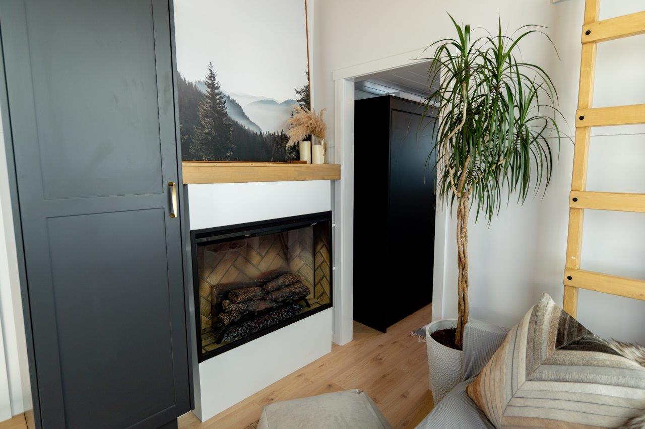 fireplace in the living area of a tiny house