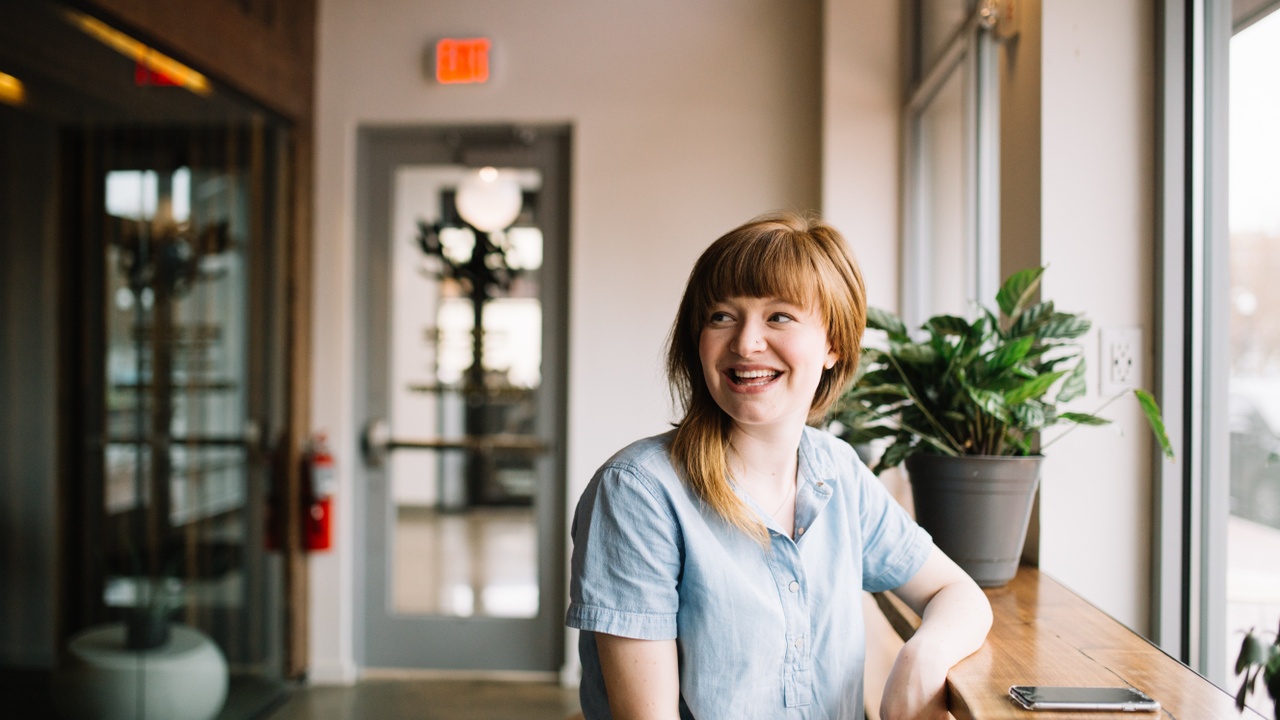 Women sitting in a coffee place smiling