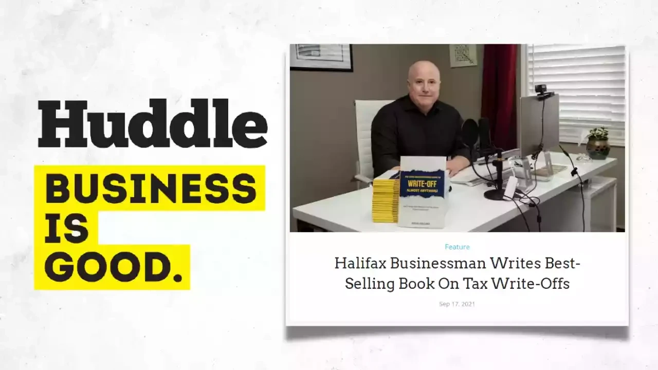 doug collins sitting at his desk with his book the home-based business guide to write-off almost anyting along with the Huddle business is good log