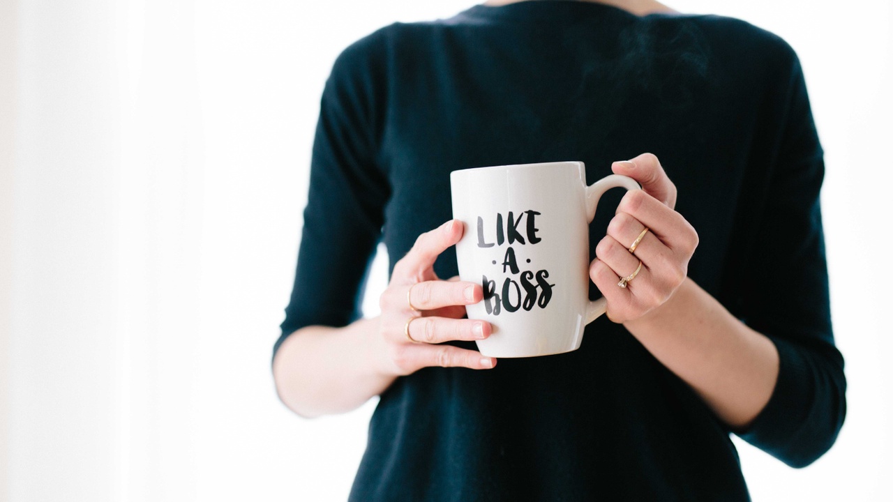 Woman holding mug like a boss