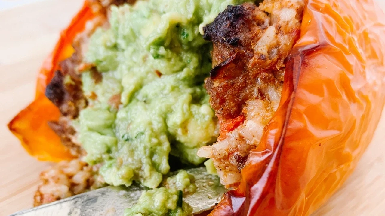 Stuffed orange bell pepper with guacamole