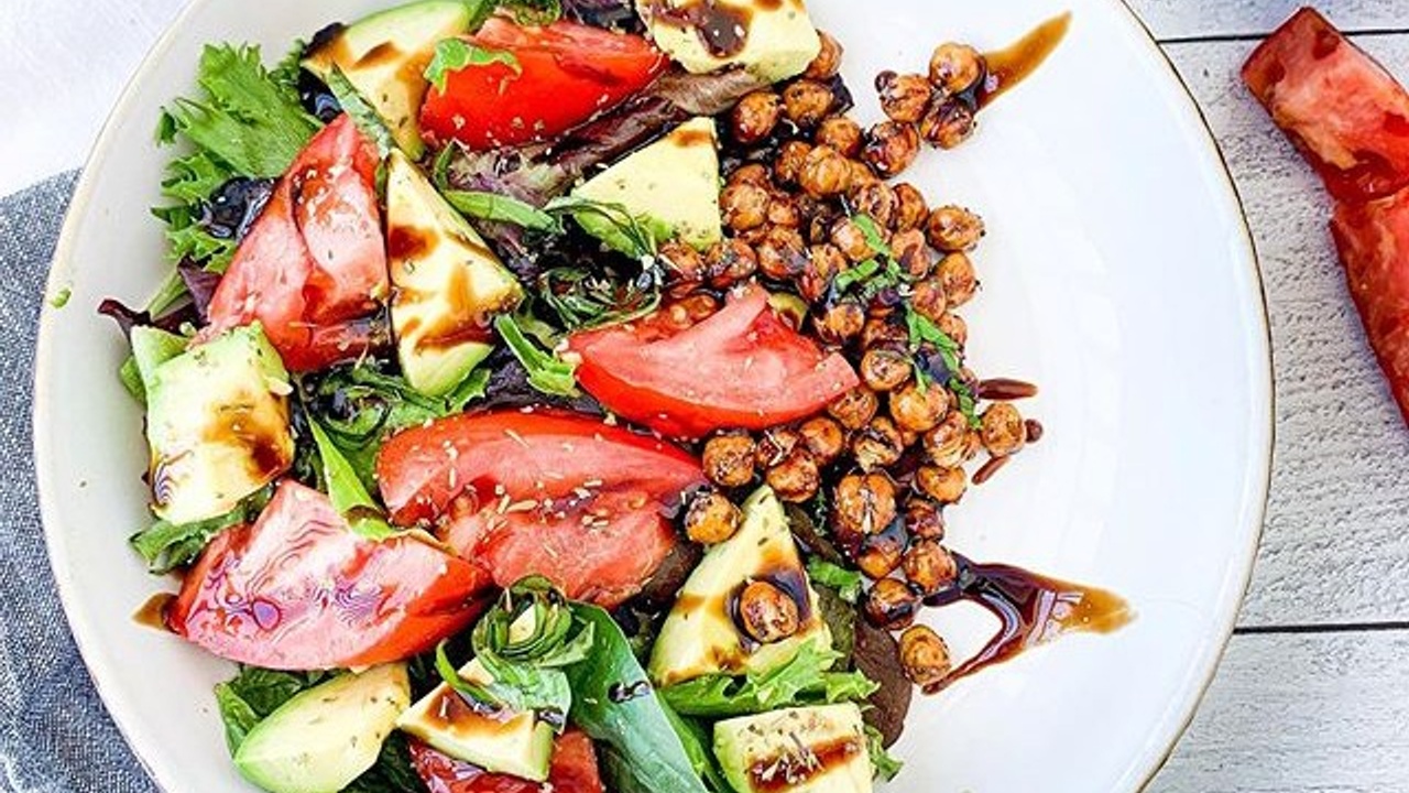 White bowl filled with chickpeas and veggies