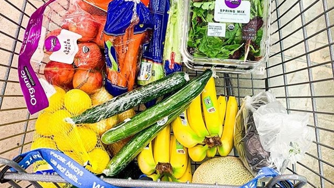 Grocery cart filled with fruits and vegetables