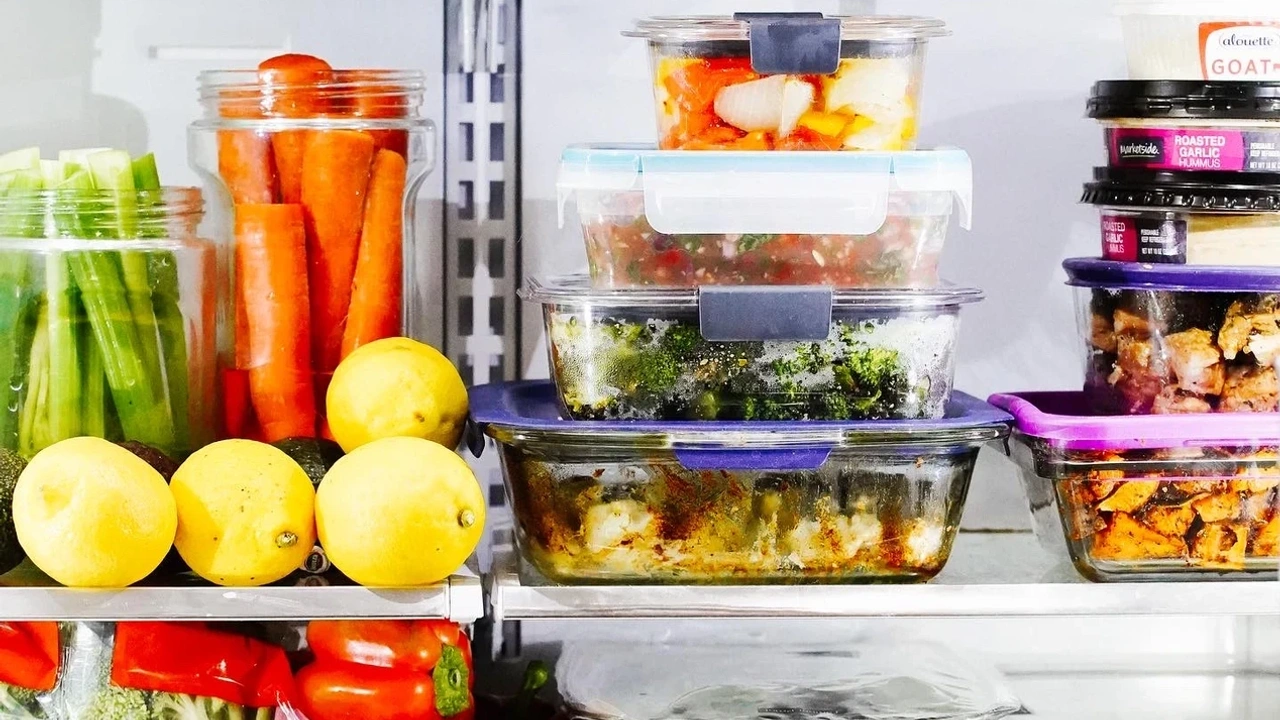 Meal prep containers and produce in a fridge