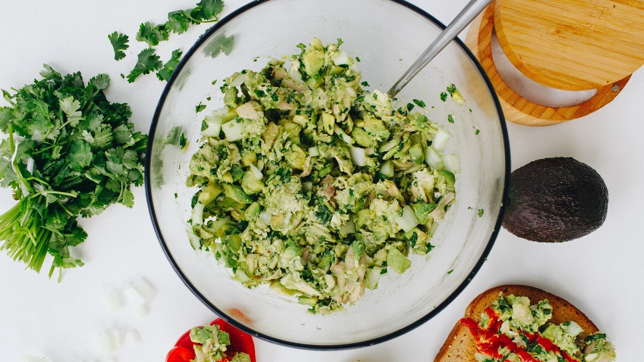 Glass bowl of avocado and chicken salad