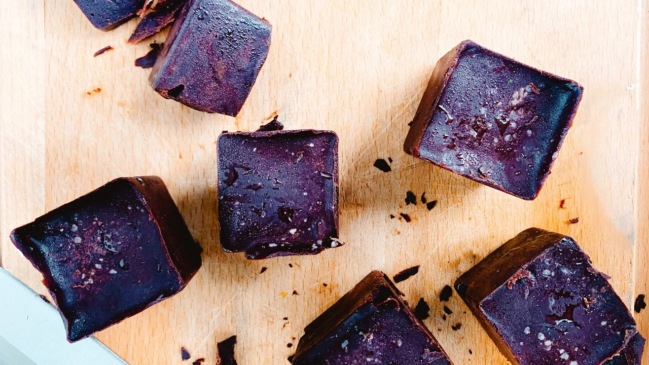 Cubes of fudge on wooden cutting board