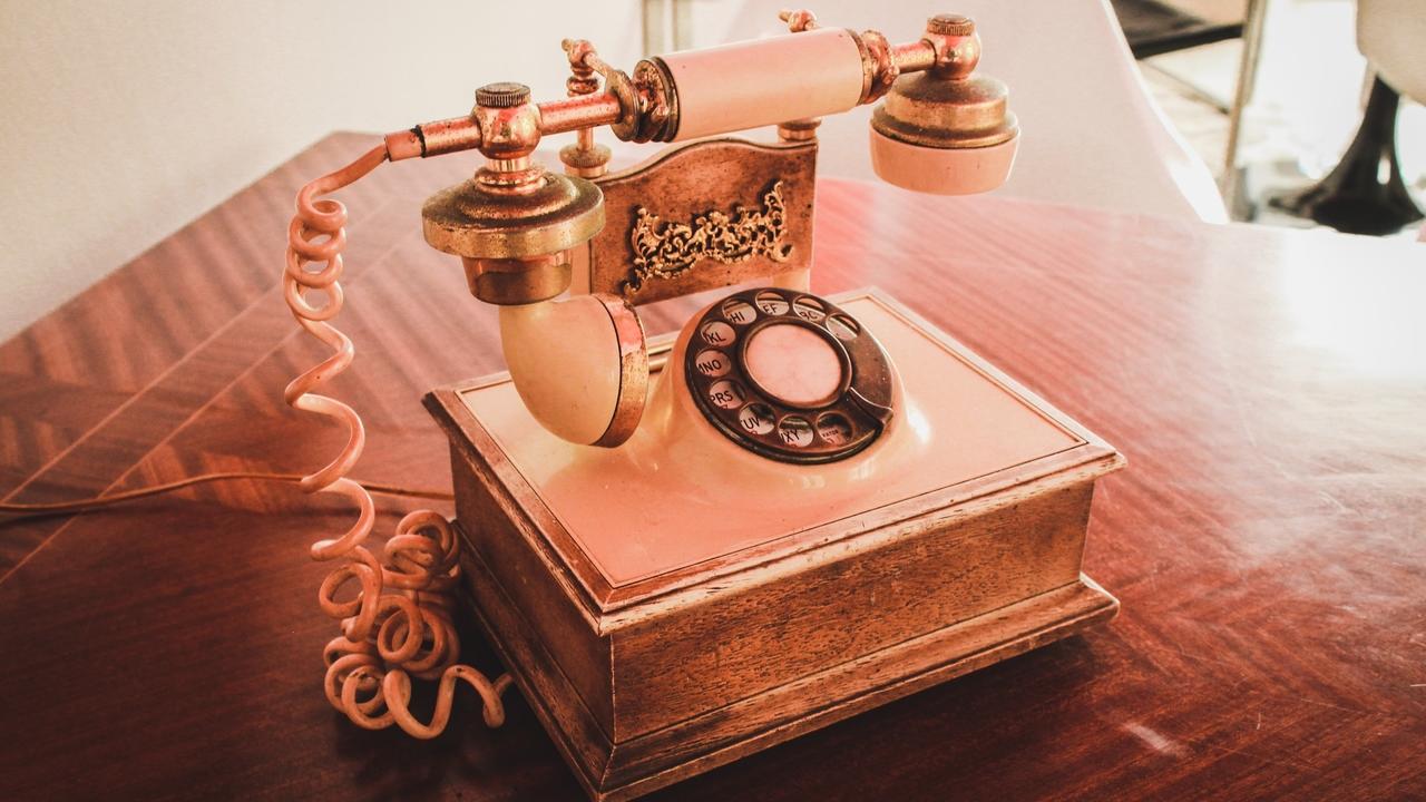 Image of vintage pink telephone.