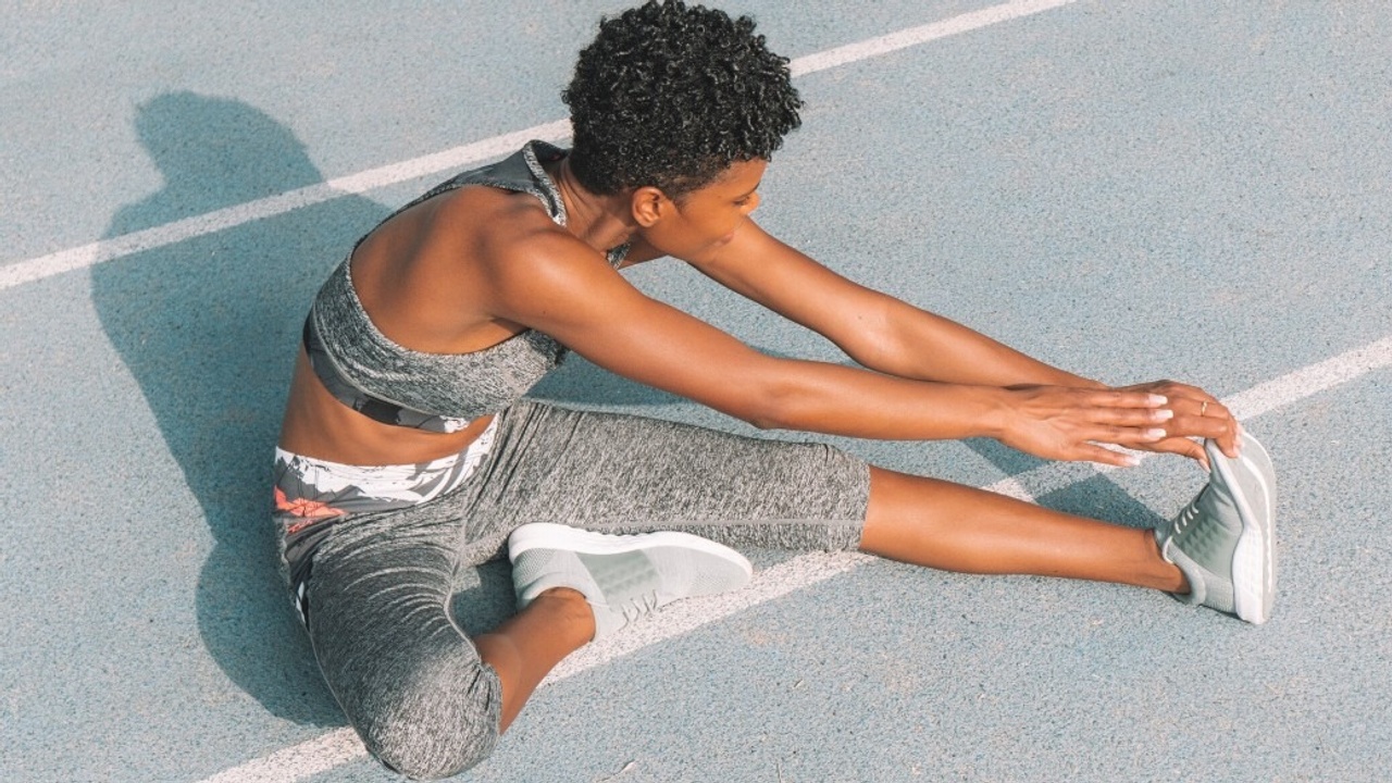 woman stretching before a run