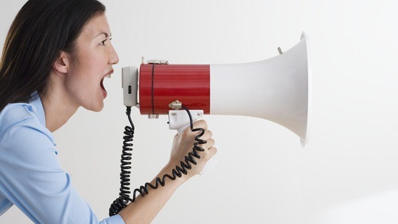 woman yelling into megaphone