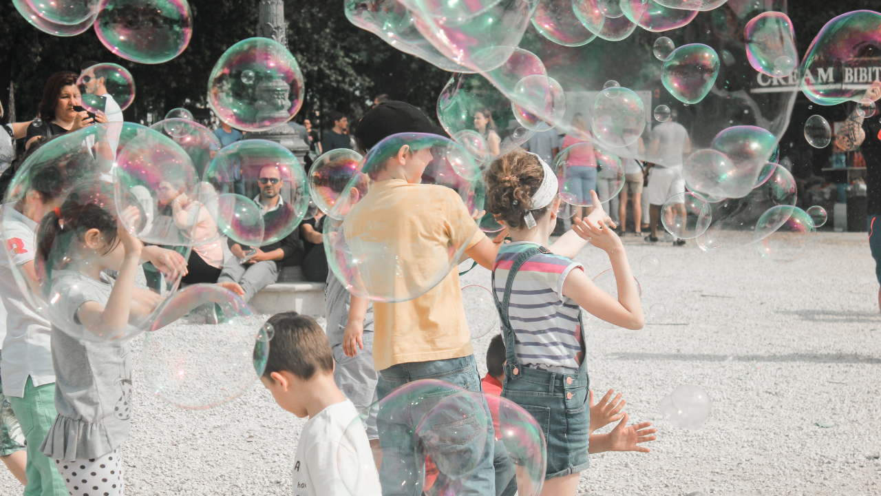 children playing in buubles