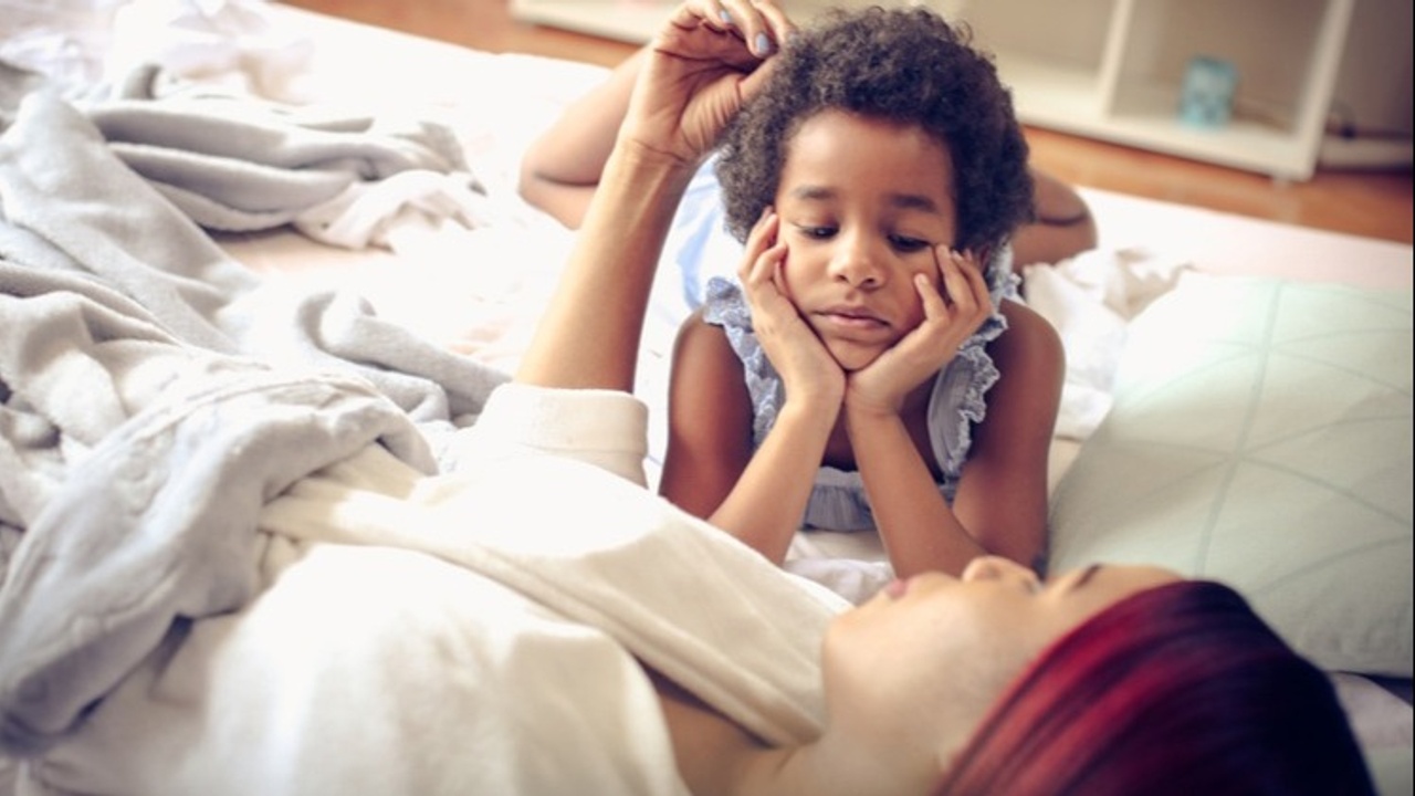 young girl talking with mother about adoption